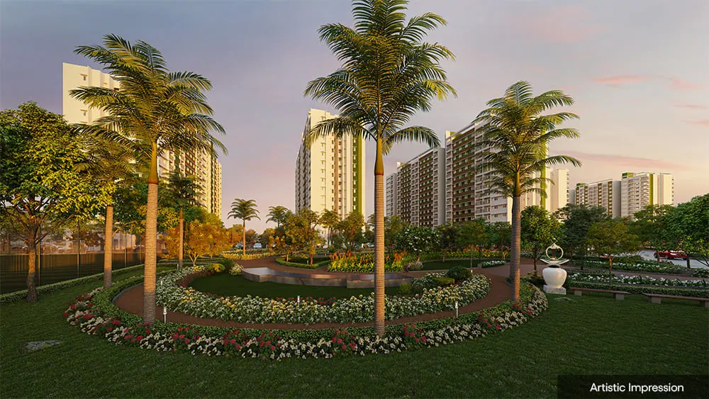 Landscaped central garden with palm trees at Adarsh Parkland